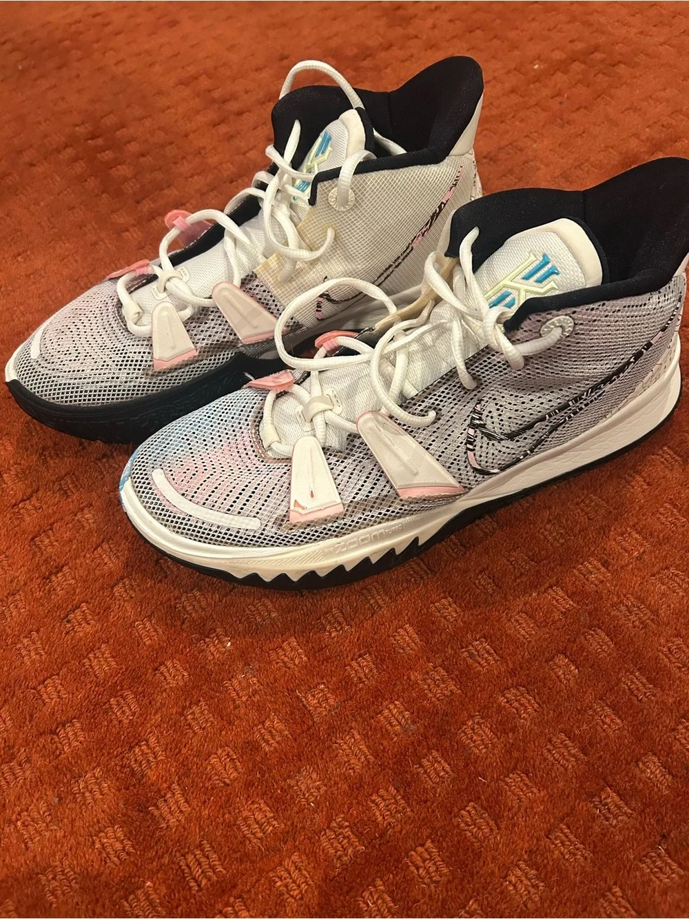 Nike Men’s  KyrieWhite Sneakers with Pink and Light Blue Accents